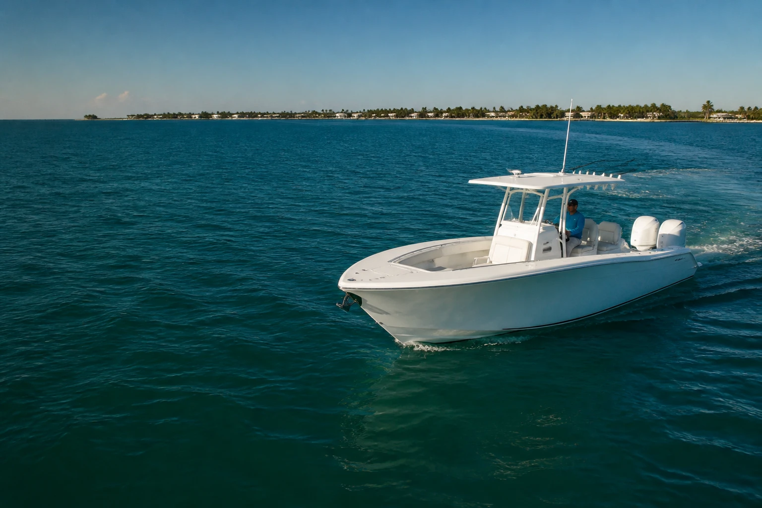 White center console boat on the turquoise waters of South Florida